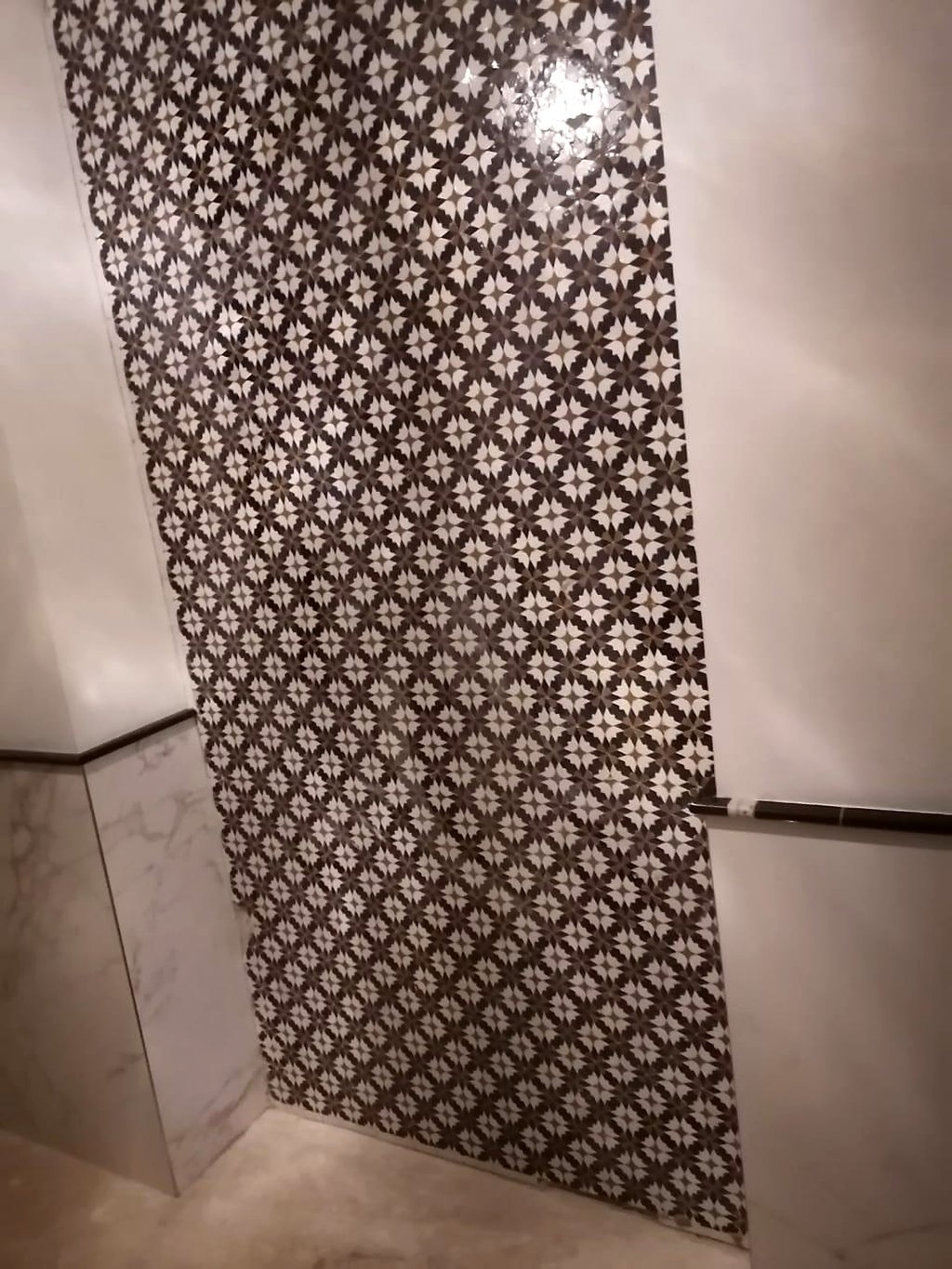 Moroccan zellige hallway wall with patterned borders at the Emirates Palace spa, Abu Dhabi