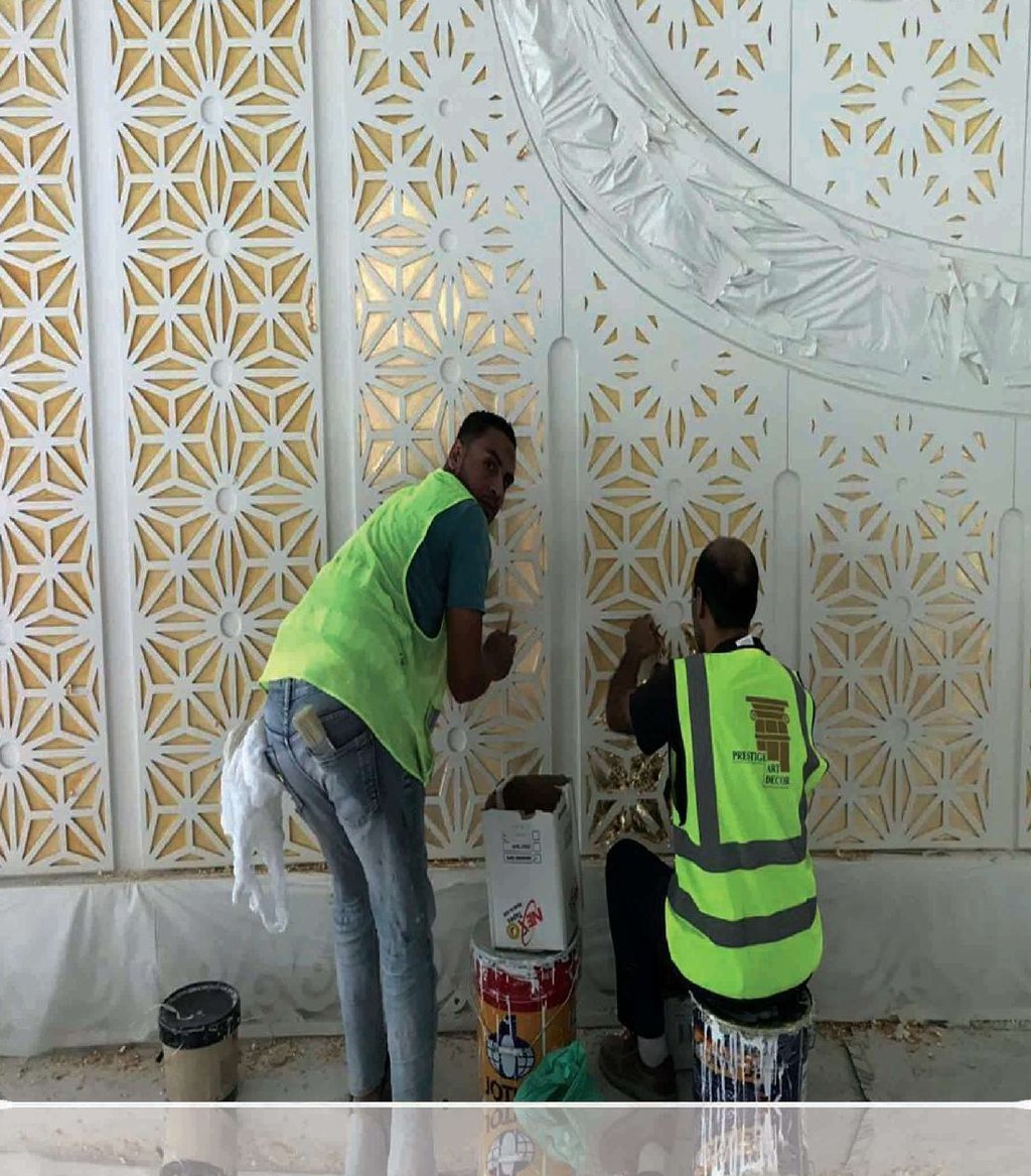 Craftsmen installing Islamic calligraphy GRG wall panels, Sheikh Khalifa Bin Zayed Al Nahyan Mosque, Al Ain